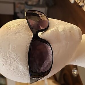 Sun glasses with bifocal line readers +400. Black with silver on side.